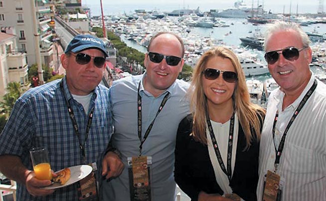 4 friends on a balcony in monaco